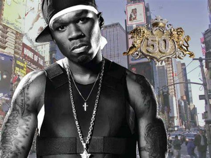 50 Cent poses with a young fan, Davian Frasier once alleged to be his third son | Image: Pinterest