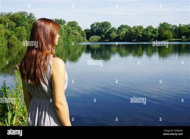 A young female overlooking a sea of clouds