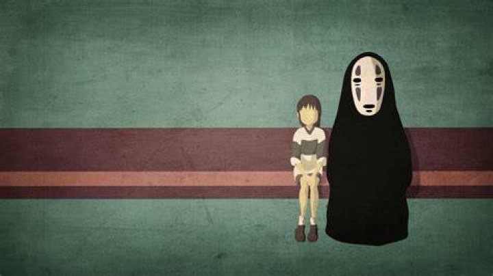 Chihiro and No Face on the train in Spirited Away