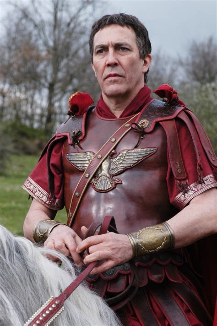 Ciaran Hinds as Julius Caesar riding on a horse in Rome 