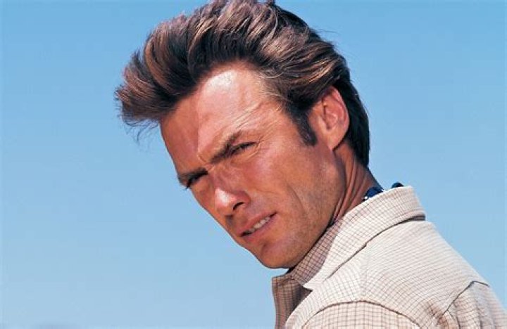 Clint Eastwood looking serious while sitting a courtroom in The Mule