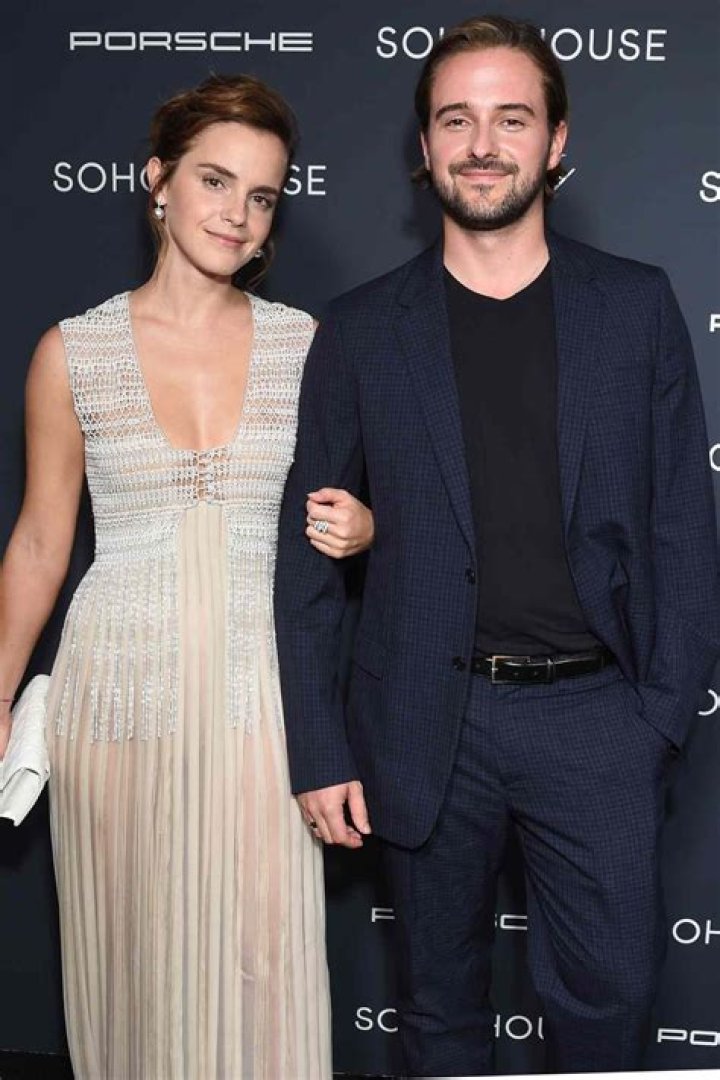 Emma Watson and Alex Watson laughing side by side