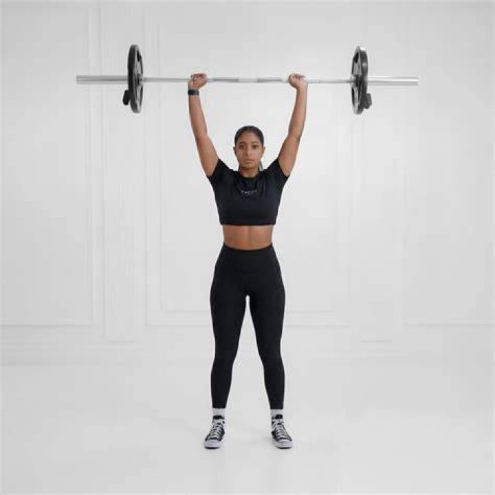 Exercise equipment, Weights, Barbell, Overhead press, Shoulder, Free weight bar, Arm, Standing, Joint, Physical fitness, 