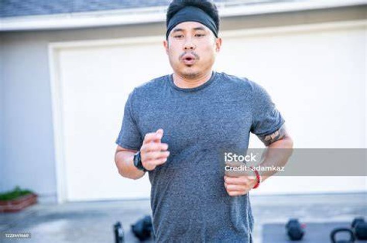 filipino man working out at home