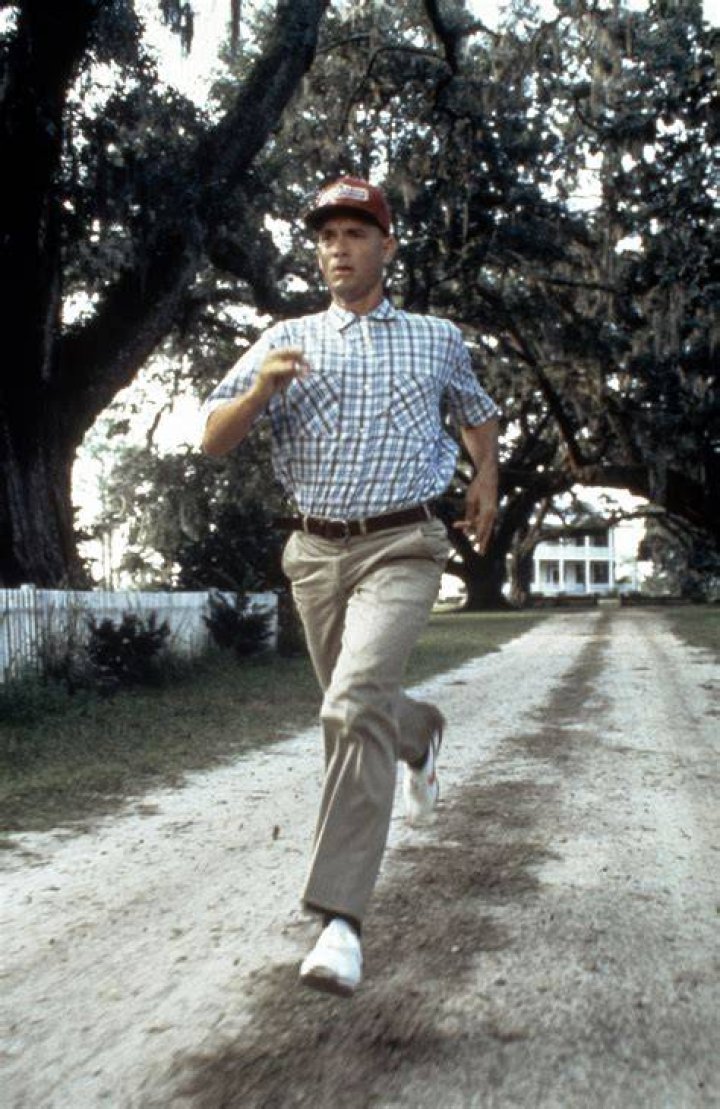 Forrest Gump Running through a tree lined street with his cap on