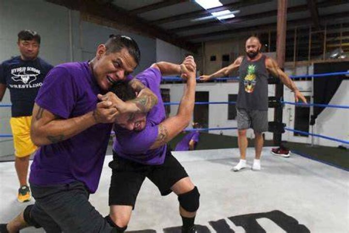 Funaki training students at the Hybrid School of Wrestling