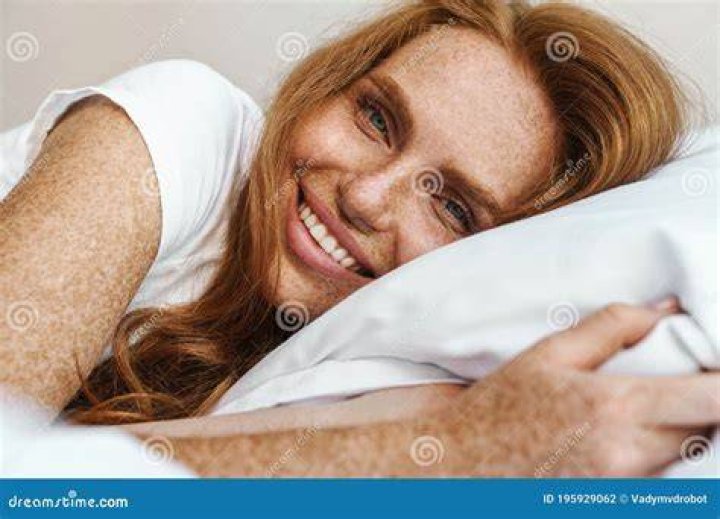 Ginger lying on her bed reading her diary
