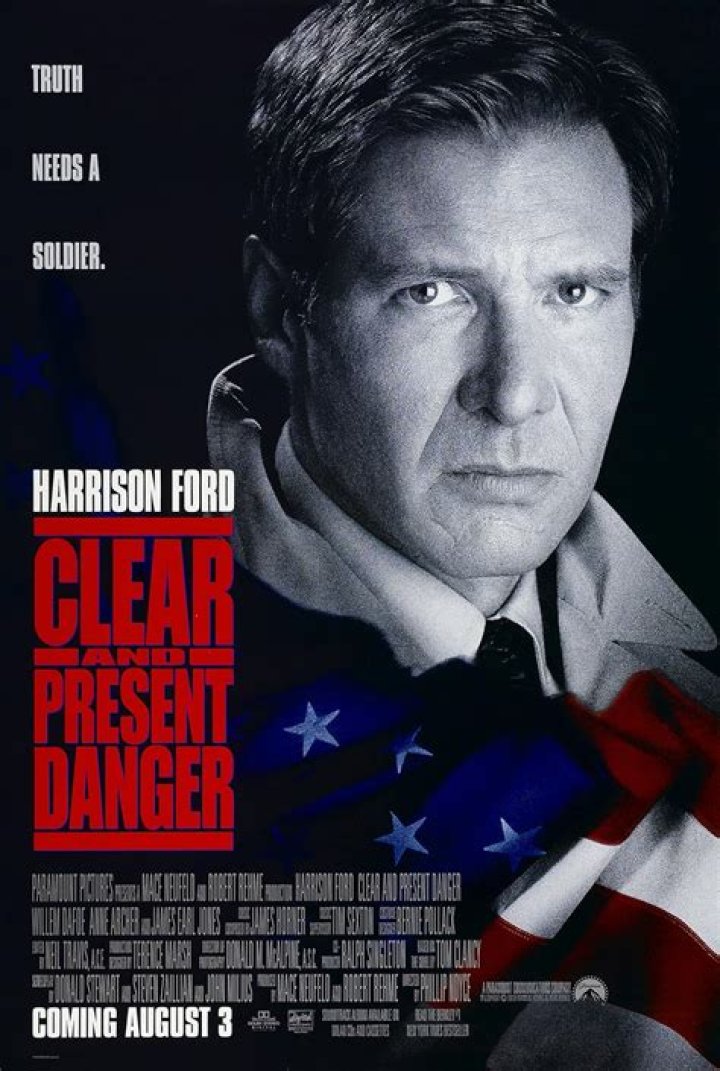 Harrison Ford as Jack Ryan holding a gun in Patriot Games