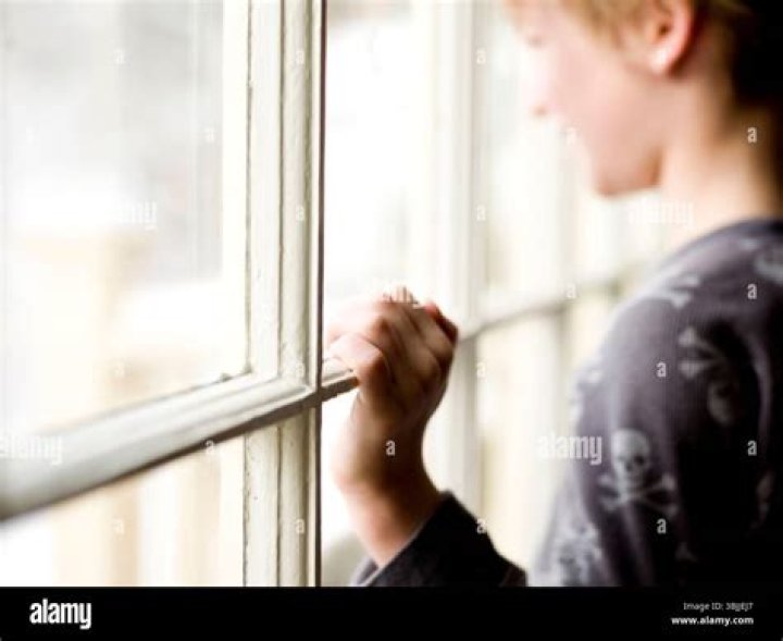 Isaac looks out the window in Sex Education