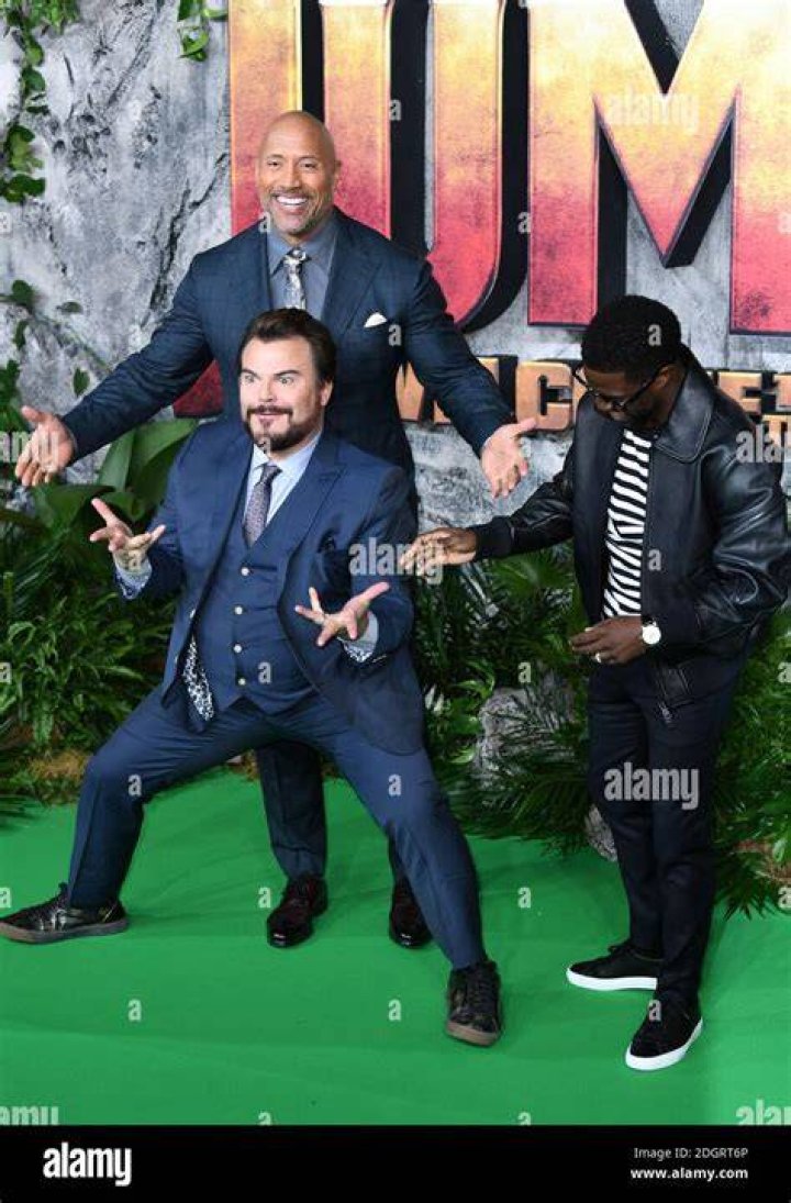 Jack Black, Dwayne Johnson, Kevin Hart, and Karen Gillan standing together in Jumanji