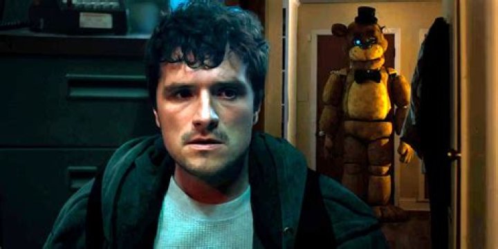 Josh Hutcherson as Mike looking at Freddy in Five Nights at Freddys