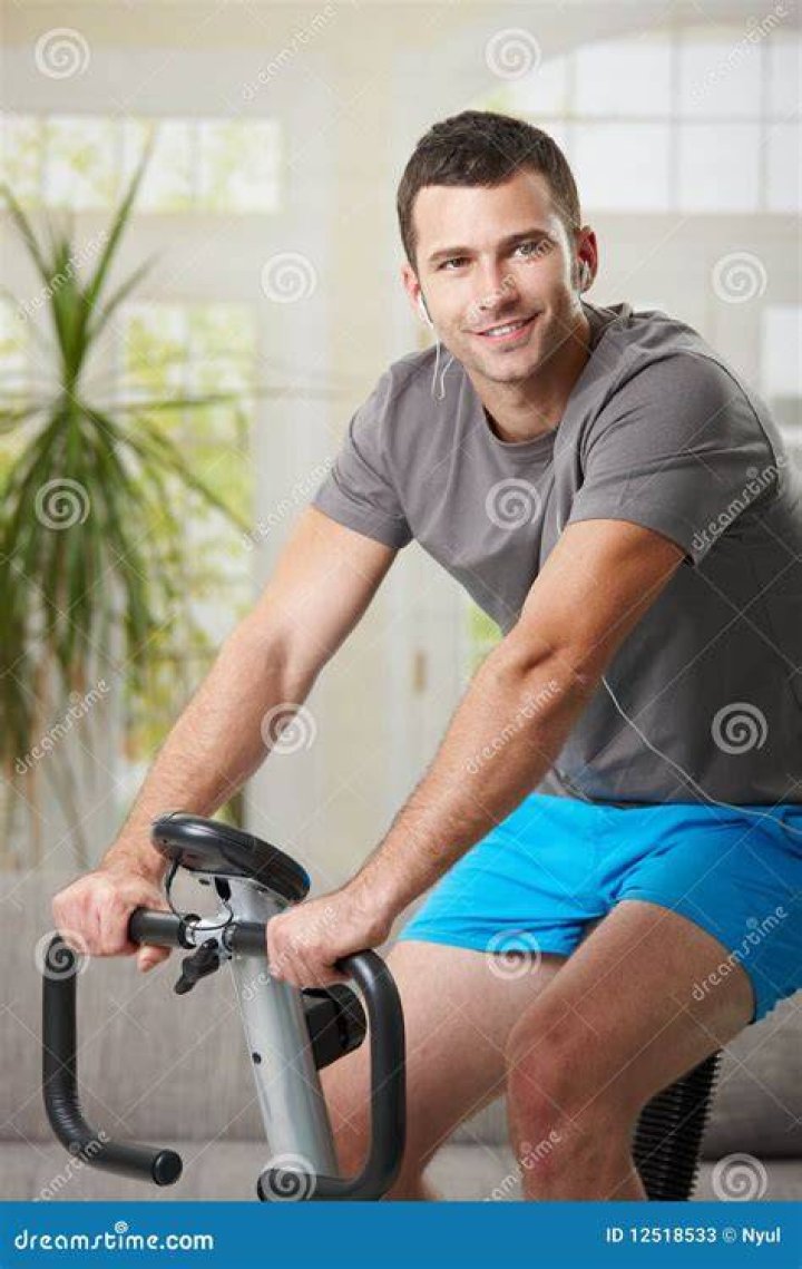 man training on exercise bike