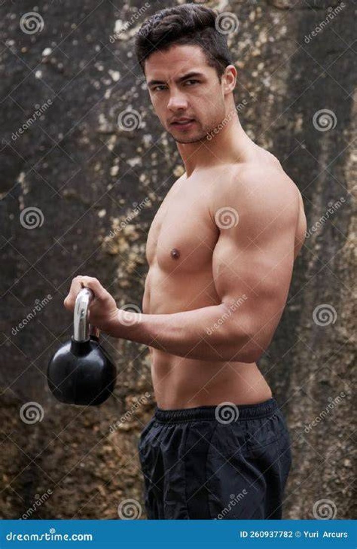 Man working out with kettle bell