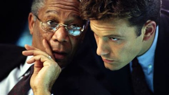 Morgan Freeman whispering to Ben Affleck in The Sum of All Fears