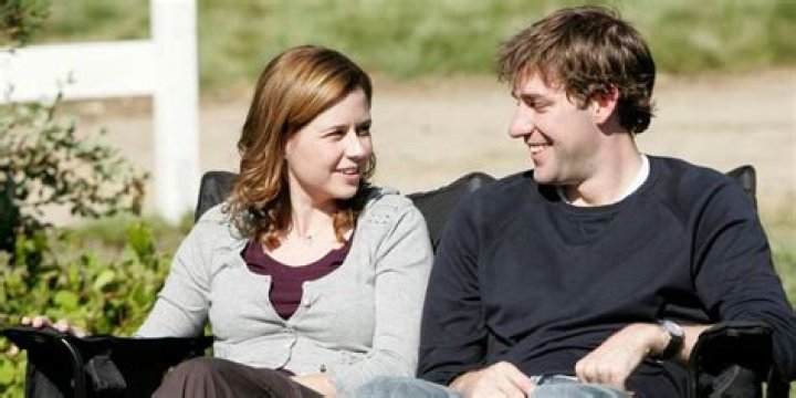 Pam and Jim sit outside happily on The Office