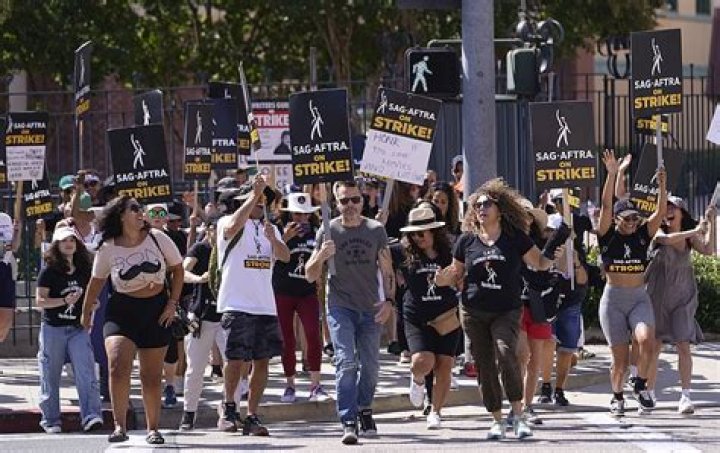 Picketers demonstrate on a line outside Disney studios in Burbank, California. Photo / AP