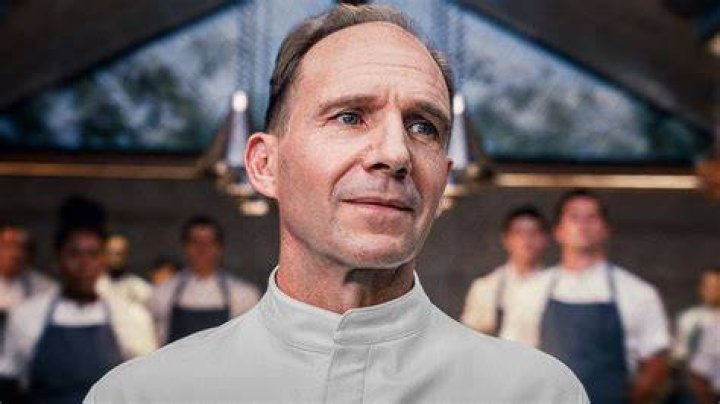 Ralph Fiennes as Chef Slowik looking at his other chefs in The Menu