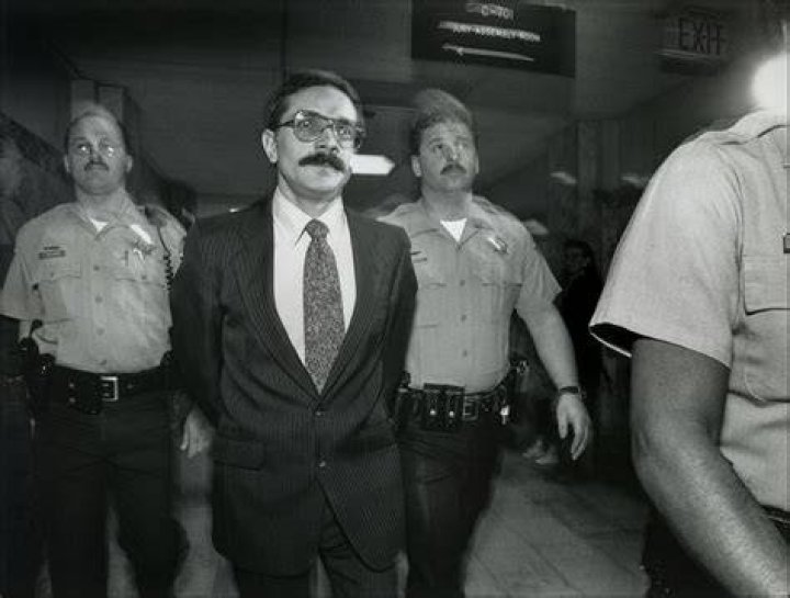 Randy Roth is led in custody