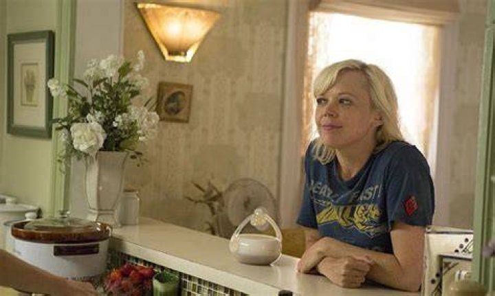Sammi Slott at the table with a tea cup in Shameless U.S.