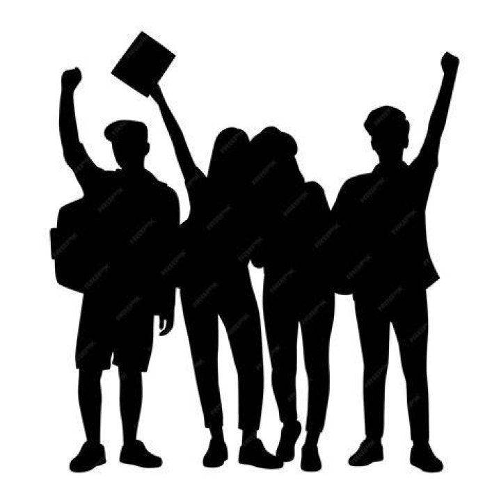 silhouette group of students on beach at sunset