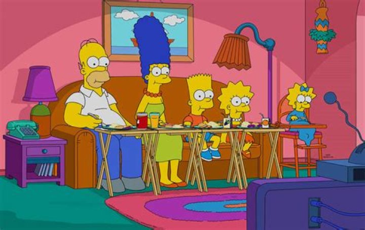 The Simpsons eating TV dinner