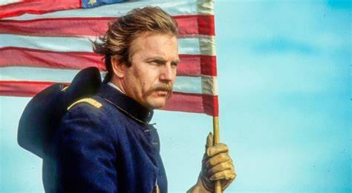 This image shows John Dunbar and Stands With A Fist about to kiss with a cutout of John Dubar looking off to the side.