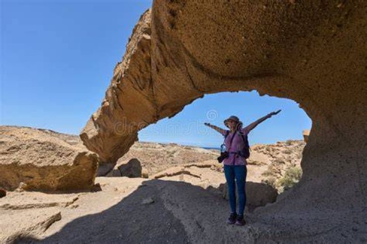 woman standing at arco de triunfo in barcelona